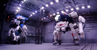 Illustration for article titled Model Hangars Look Much Better With Tiny Mecha Inside